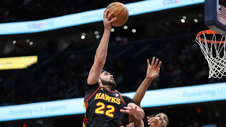 Feb 8, 2025; Washington, District of Columbia, USA; Atlanta Hawks forward Larry Nance Jr. (22) takes a shot over Washington Wizards guard Malcolm Brogdon (15) during the first half at Capital One Arena. Mandatory Credit: Daniel Kucin Jr.-Imagn Images