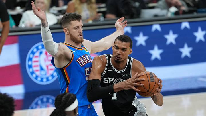 May 22, 2026; San Antonio, Texas, USA; San Antonio Spurs forward Victor Wembanyama (1) dribbles the ball past Oklahoma City Thunder center Isaiah Hartenstein (55) in the second half during game three of the western conference finals for the 2026 NBA playoffs at Frost Bank Center. Mandatory Credit: Daniel Dunn-Imagn Images May 22, 2026; San Antonio, Texas, USA; San Antonio Spurs forward Victor Wembanyama (1) dribbles the ball past Oklahoma City Thunder center Isaiah Hartenstein (55) in the second half during game three of the western conference finals for the 2026 NBA playoffs at Frost Bank Center. Mandatory Credit: Daniel Dunn-Imagn Images
