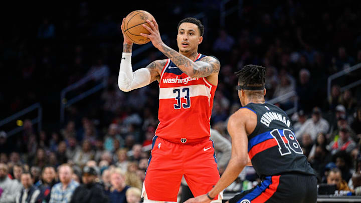 Mar 29, 2024; Washington, District of Columbia, USA; Washington Wizards forward Kyle Kuzma (33) looks to pass against Detroit Pistons forward Tosan Evbuomwan (18) during the first quarter at Capital One Arena.
