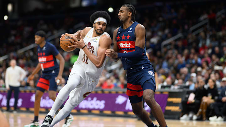 Oct 26, 2024; Washington, District of Columbia, USA; Cleveland Cavaliers center Jarrett Allen (31) drives the ball against Washington Wizards forward Alexandre Sarr (20) during the fourth quarter at Capital One Arena. Mandatory Credit: Reggie Hildred-Imagn Images