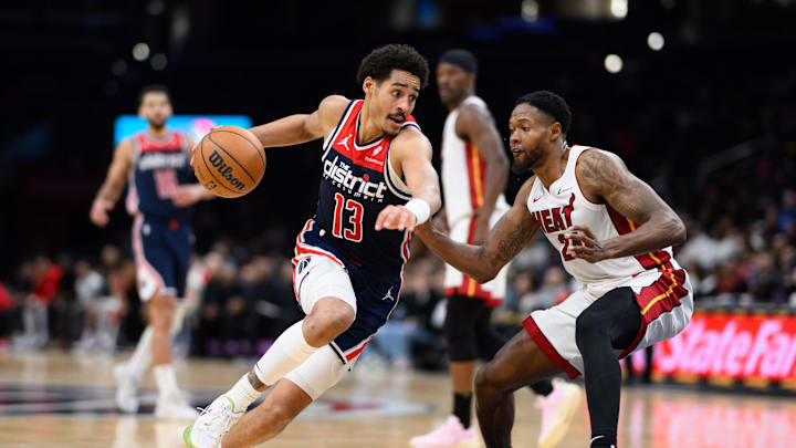 Mar 31, 2024; Washington, District of Columbia, USA; Washington Wizards guard Jordan Poole (13) drives to the basket against Miami Heat forward Haywood Highsmith (24) during the third quarter at Capital One Arena. Mandatory Credit: Reggie Hildred-Imagn Images