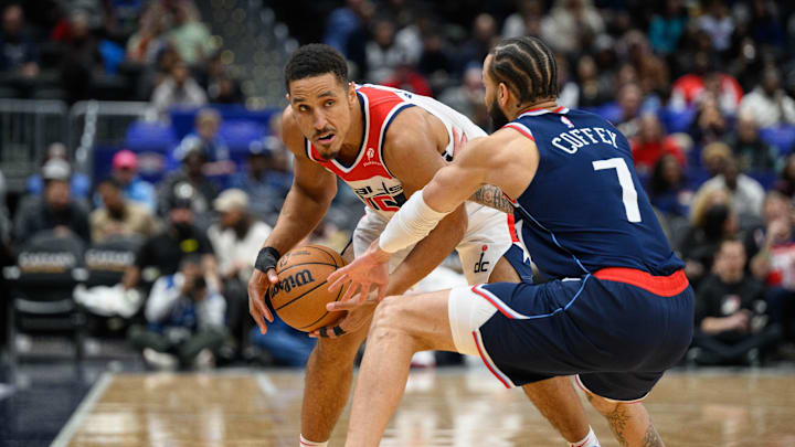 Nov 27, 2024; Washington, District of Columbia, USA; Washington Wizards guard Malcolm Brogdon (15) controls the ball against LA Clippers guard Amir Coffey (7) during the first quarter at Capital One Arena. Mandatory Credit: Reggie Hildred-Imagn Images