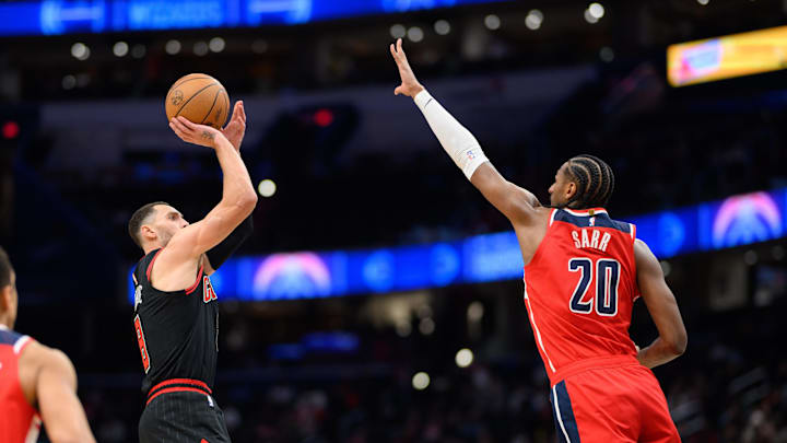 Jan 1, 2025; Washington, District of Columbia, USA; Chicago Bulls guard Zach LaVine (8) takes a jump shot over Washington Wizards forward Alexandre Sarr (20) during the fourth quarter at Capital One Arena. Mandatory Credit: Reggie Hildred-Imagn Images