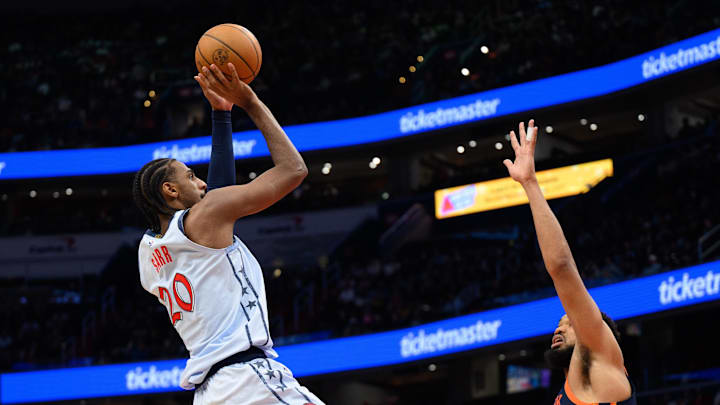 Dec 30, 2024; Washington, District of Columbia, USA; Washington Wizards forward Alexandre Sarr (20) shoots over New York Knicks center Karl-Anthony Towns (32) during the fourth quarter at Capital One Arena. Mandatory Credit: Reggie Hildred-Imagn Images