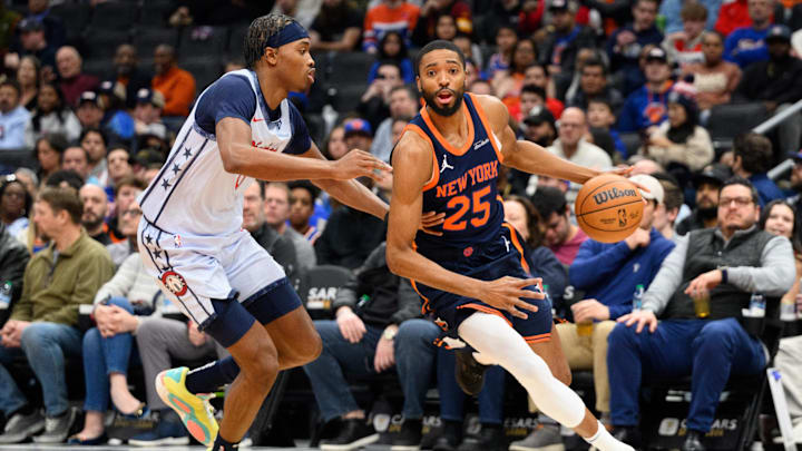 Dec 30, 2024; Washington, District of Columbia, USA; New York Knicks forward Mikal Bridges (25) drives to the basket against Washington Wizards guard Bilal Coulibaly (0) during the second quarter at Capital One Arena. Mandatory Credit: Reggie Hildred-Imagn Images