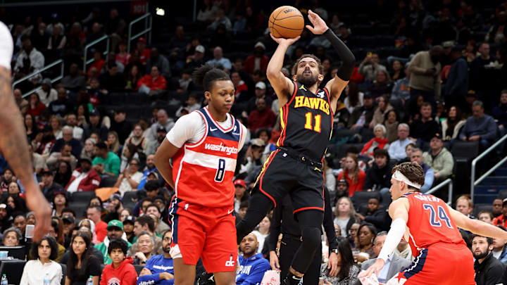 Feb 8, 2025; Washington, District of Columbia, USA; Atlanta Hawks guard Trae Young (11) shoots against Washington Wizards guard Bub Carrington (8) during the first half at Capital One Arena. Mandatory Credit: Daniel Kucin Jr.-Imagn Images Feb 8, 2025; Washington, District of Columbia, USA; Atlanta Hawks guard Trae Young (11) shoots against Washington Wizards guard Bub Carrington (8) during the first half at Capital One Arena. Mandatory Credit: Daniel Kucin Jr.-Imagn Images