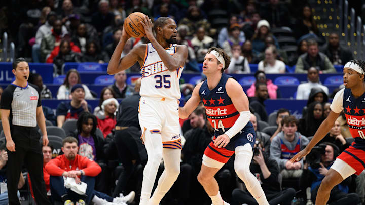 Jan 16, 2025; Washington, District of Columbia, USA; Phoenix Suns forward Kevin Durant (35) posts up Washington Wizards forward Corey Kispert (24) during the first quarter at Capital One Arena. Mandatory Credit: Reggie Hildred-Imagn Images