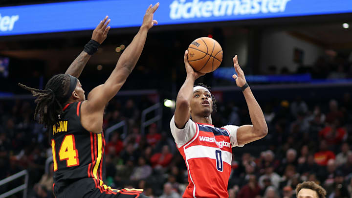 Feb 8, 2025; Washington, District of Columbia, USA; Washington Wizards guard Bilal Coulibaly (0) takes a shot over Atlanta Hawks guard Terance Mann (14) during the second half at Capital One Arena. Mandatory Credit: Daniel Kucin Jr.-Imagn Images Feb 8, 2025; Washington, District of Columbia, USA; Washington Wizards guard Bilal Coulibaly (0) takes a shot over Atlanta Hawks guard Terance Mann (14) during the second half at Capital One Arena. Mandatory Credit: Daniel Kucin Jr.-Imagn Images
