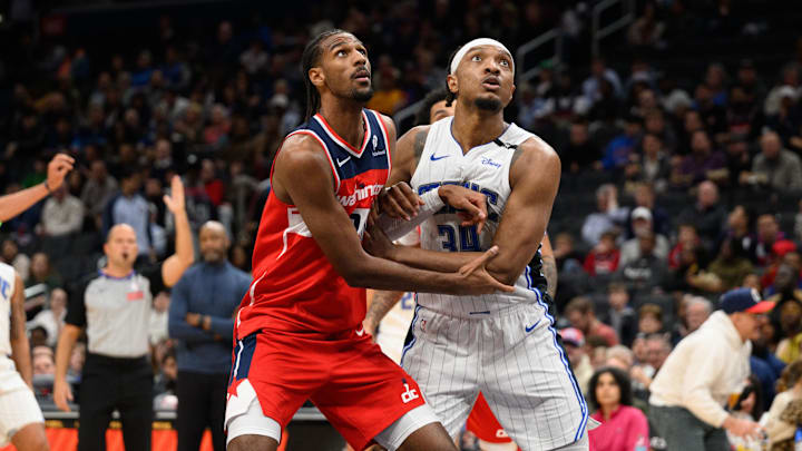 Mar 21, 2025; Washington, District of Columbia, USA; Washington Wizards forward Alex Sarr (20) and Orlando Magic center Wendell Carter Jr. (34) battle for position during the third quarter at Capital One Arena. Mandatory Credit: Reggie Hildred-Imagn Images