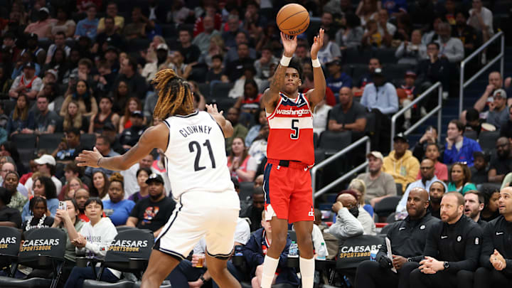 Mar 29, 2025; Washington, District of Columbia, USA; Washington Wizards guard AJ Johnson (5) takes a shot over Brooklyn Nets forward Noah Clowney (21) during the second half at Capital One Arena. Mandatory Credit: Daniel Kucin Jr.-Imagn Images