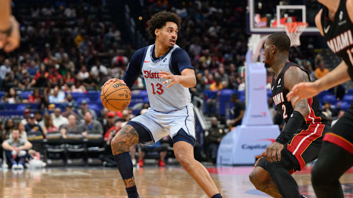 Mar 31, 2025; Washington, District of Columbia, USA; Washington Wizards guard Jordan Poole (13) handles the ball against Miami Heat guard Terry Rozier (2) during the third quarter at Capital One Arena. Mandatory Credit: Reggie Hildred-Imagn Images
