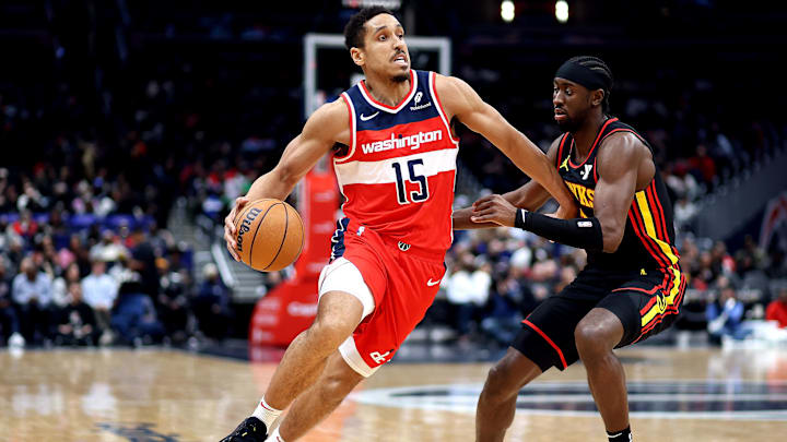 Feb 8, 2025; Washington, District of Columbia, USA; Washington Wizards guard Malcolm Brogdon (15) drives past Atlanta Hawks guard Caris LeVert (3) during the second half at Capital One Arena. Mandatory Credit: Daniel Kucin Jr.-Imagn Images
