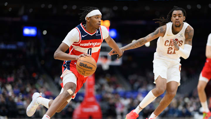 Feb 7, 2025; Washington, District of Columbia, USA; Washington Wizards guard Bilal Coulibaly (0) drives to the basket against Cleveland Cavaliers forward Emoni Bates (21) during the second quarter at Capital One Arena. Mandatory Credit: Reggie Hildred-Imagn Images