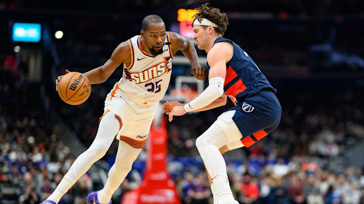 Jan 16, 2025; Washington, District of Columbia, USA; Phoenix Suns forward Kevin Durant (35) drives to the basket Washington Wizards forward Corey Kispert (24) during the third quarter at Capital One Arena. Mandatory Credit: Reggie Hildred-Imagn Images