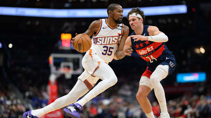 Jan 16, 2025; Washington, District of Columbia, USA; Phoenix Suns forward Kevin Durant (35) drives to the basket Washington Wizards forward Corey Kispert (24) during the third quarter at Capital One Arena. Mandatory Credit: Reggie Hildred-Imagn Images