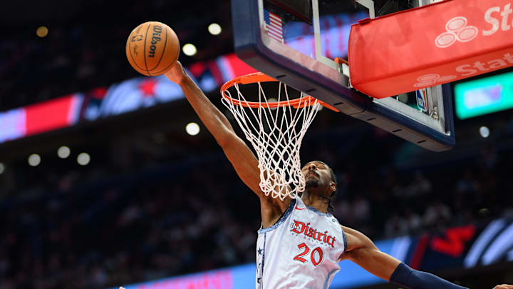 Mar 31, 2025; Washington, District of Columbia, USA; Washington Wizards forward Alex Sarr (20) blocks a shot during the first quarter against the Miami Heat at Capital One Arena. Mandatory Credit: Reggie Hildred-Imagn Images