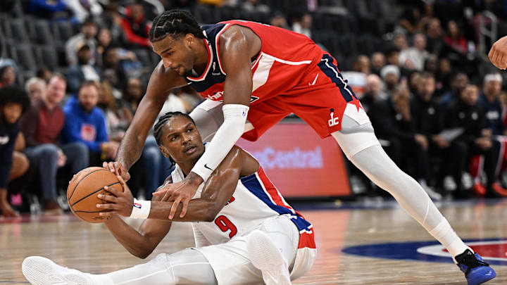 Oct 16, 2025; Detroit, Michigan, USA; Detroit Pistons guard/forward Ausar Thompson (9) looks for an open teammate to pass the ball while defended by Washington Wizards center Alex Sarr (20) in the second quarter at Little Caesars Arena. Mandatory Credit: Lon Horwedel-Imagn Images