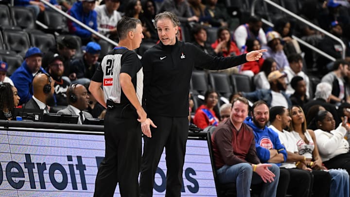 Oct 16, 2025; Detroit, Michigan, USA; Washington Wizards Head Coach Brian Keefe argues with official Pat Fraher during their game against the Detroit Pistons in the second quarter at Little Caesars Arena. Mandatory Credit: Lon Horwedel-Imagn Images