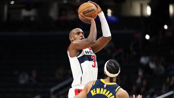 Mar 27, 2025; Washington, District of Columbia, USA; Washington Wizards forward Khris Middleton (32) takes a shot over Indiana Pacers guard Andrew Nembhard (2) during the first half at Capital One Arena. Mandatory Credit: Daniel Kucin Jr.-Imagn Images