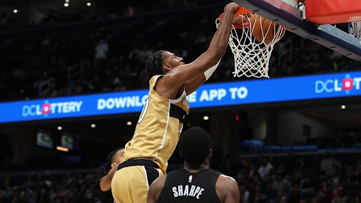 Jan 2, 2026; Washington, District of Columbia, USA; Washington Wizards center Alex Sarr (20) dunks over Brooklyn Nets center Day'Ron Sharpe (20) during the second half at Capital One Arena. Mandatory Credit: Daniel Kucin Jr.-Imagn Images