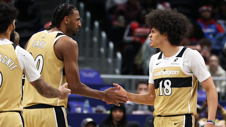 Jan 29, 2026; Washington, District of Columbia, USA; Washington Wizards forward Kyshawn George (18) celebrates with center Alex Sarr (20) during the first half against the Milwaukee Bucks at Capital One Arena. Mandatory Credit: Daniel Kucin Jr.-Imagn Images