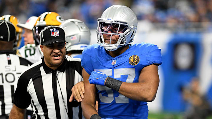 Nov 23, 2023; Detroit, Michigan, USA; Detroit Lions linebacker Anthony Pittman (57) engages with the referee during their game against the Green Bay Packers in the third quarter at Ford Field. Mandatory Credit: Lon Horwedel-Imagn Images