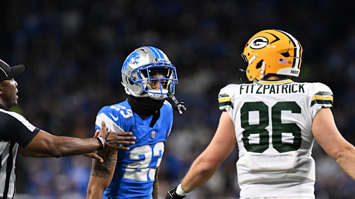 Dec 5, 2024; Detroit, Michigan, USA;  Detroit Lions cornerback Carlton Davis III (23) and Green Bay Packers tight end John FitzPatrick (86) exchange words in the second quarter at Ford Field. Mandatory Credit: Lon Horwedel-Imagn Images