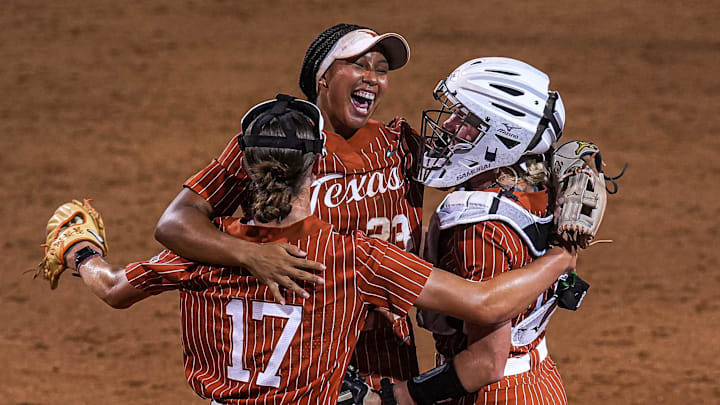 Texas Longhorns pitcher Teagan Kavan (17), short stop Viviana Martinez (23) and Reese Atwood (14) celebrate the 6-5 win over Texas A&M in the game three NCAA Super Regional at Red & Charline McCombs Field on Sunday, May 26, 2024 in Austin.