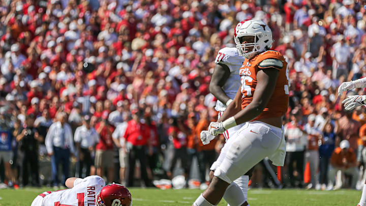 Texas defensive lineman Alfred Collins celebrates a sack. Texas took on Oklahoma in the 2021 Red River Showdown at the Cotton Bowl in Dallas, Texas on Oct. 9, 2021.