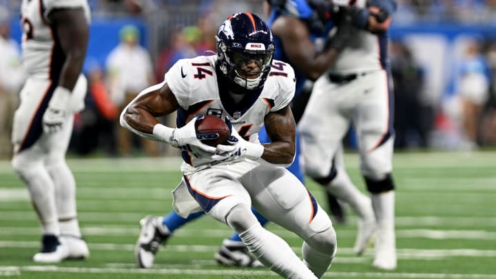 Dec 16, 2023; Detroit, Michigan, USA; Denver Broncos wide receiver Courtland Sutton (14) runs with the ball against the Detroit Lions in the third quarter at Ford Field. Mandatory Credit: Lon Horwedel-USA TODAY Sports
