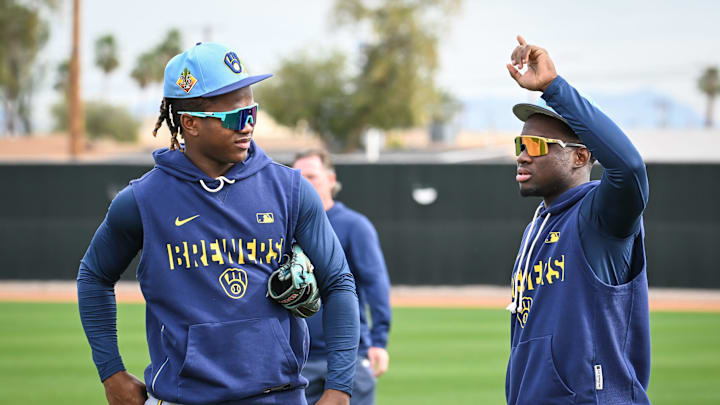 Milwaukee Brewers infielder Jesús Made, left, talks with outfielder Luis Lara during spring training workouts Monday, February 16, 2026, at American Family Fields of Phoenix in Phoenix, Arizona.