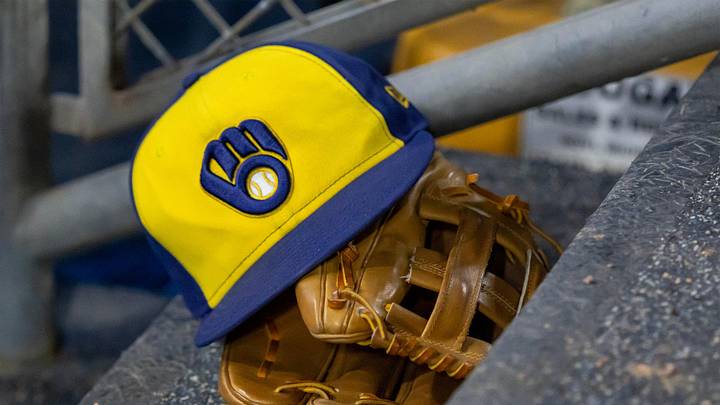 Apr 21, 2026; Detroit, Michigan, USA; A Milwaukee Brewers hat and glove in the dugout during the seventh inning against the Detroit Tigers at Comerica Park. Mandatory Credit: David Reginek-Imagn Images