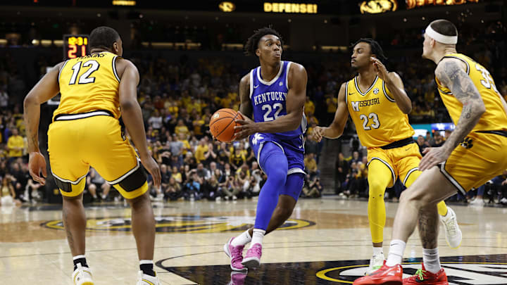 Mar 8, 2025; Columbia, Missouri, USA; Kentucky Wildcats center Amari Williams (22) drives to the basket against  Missouri Tigers guard Aidan Shaw (23) and guard Jacob Crews (35) in the second half at Mizzou Arena. Mandatory Credit: Gary Rohman-Imagn Images