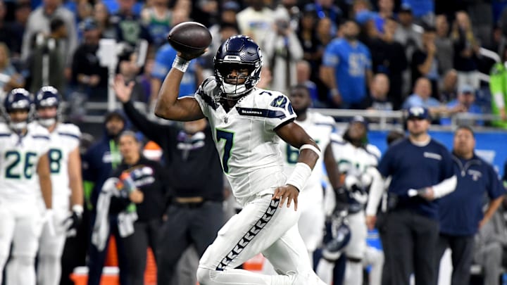 Sep 30, 2024; Detroit, Michigan, USA; Seattle Seahawks quarterback Geno Smith (7) rolls out to pass against the Detroit Lions in the fourth quarter at Ford Field.