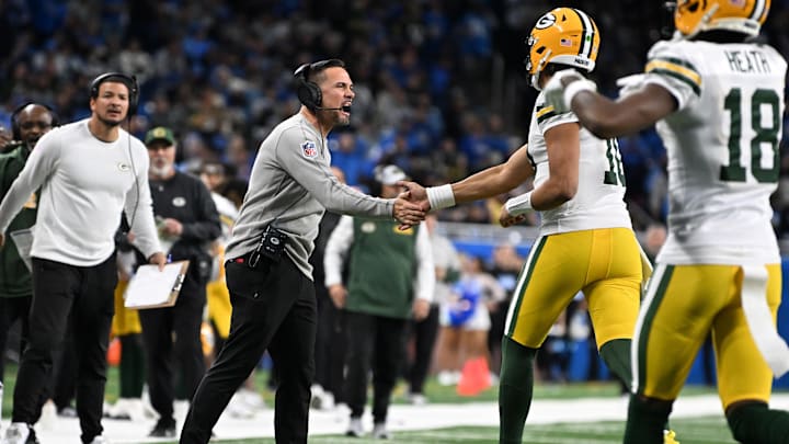 Green Bay Packers head coach Matt LeFleur celebrates with quarterback Jordan Love (10) after a touchdown at Detroit.