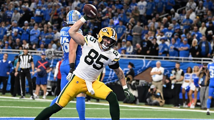 Green Bay Packers tight end Tucker Kraft (85) spikes the ball after catching a touchdown pass against the Detroit Lions.