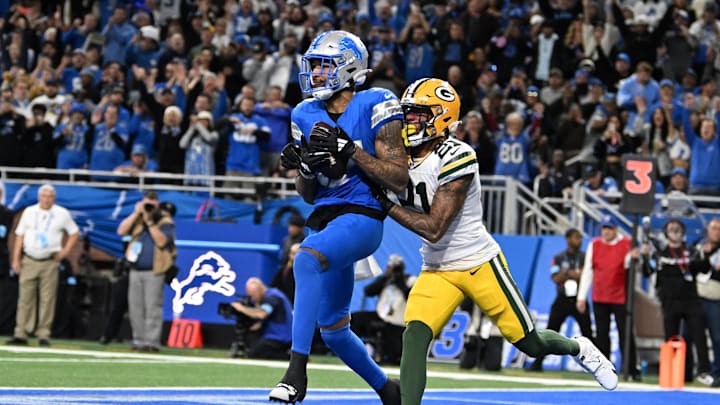Detroit Lions wide receiver Tim Patrick (17) catches a a touchdown pass in front of Green Bay Packers cornerback Eric Stokes.