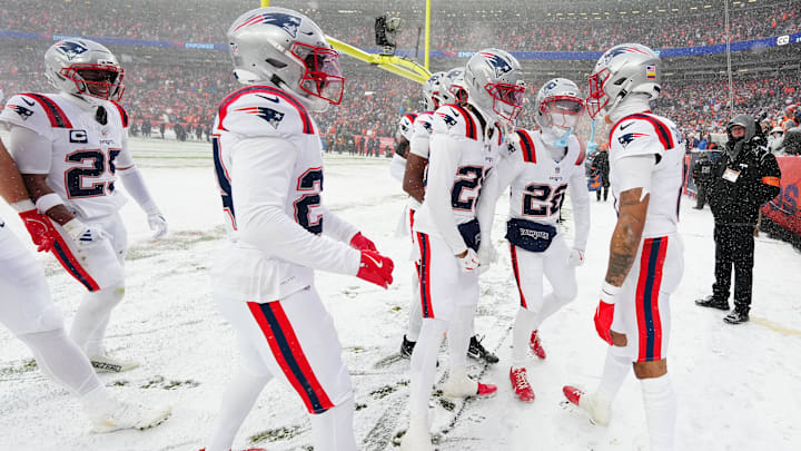 Jan 25, 2026; Denver, CO, USA; New England Patriots cornerback Christian Gonzalez (0) reacts after an interception against the Denver Broncos  during the 2026 AFC Championship Game at Empower Field at Mile High. Mandatory Credit: Ron Chenoy-Imagn Images