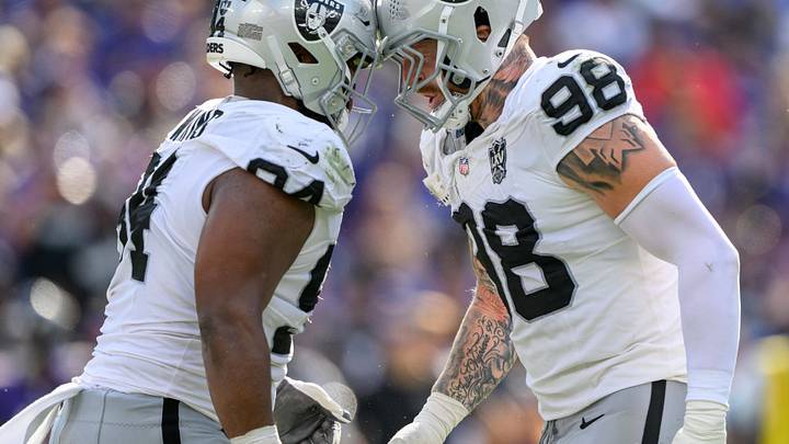 Sep 15, 2024; Baltimore, Maryland, USA; Las Vegas Raiders defensive tackle Christian Wilkins (94) and defensive end Maxx Crosby (98) celebrate after a sack during the second half against the Baltimore Ravens at M&T Bank Stadium. Mandatory Credit: Reggie Hildred-Imagn Images