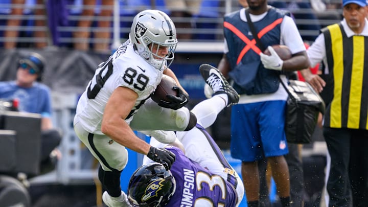 Sep 15, 2024; Baltimore, Maryland, USA; Las Vegas Raiders tight end Brock Bowers (89) is tackled by Baltimore Ravens linebacker Trenton Simpson (23) during the second half at M&T Bank Stadium. Mandatory Credit: Reggie Hildred-Imagn Images