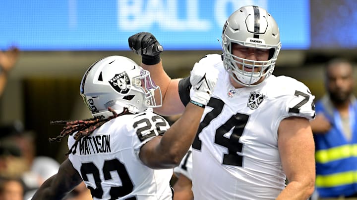 Sep 8, 2024; Inglewood, California, USA; Las Vegas Raiders running back Alexander Mattison (22) is congratulated by offensive tackle Kolton Miller (74) after scoring a touchdown in the first half against the Los Angeles Chargers at SoFi Stadium. Mandatory Credit: Jayne Kamin-Oncea-Imagn Images