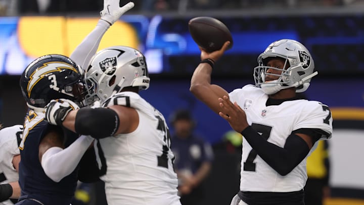 Nov 30, 2025; Inglewood, California, USA;Las Vegas Raiders quarterback Geno Smith (7) drops back to pass against the Los Angeles Chargers during the first half at SoFi Stadium. Mandatory Credit: Kiyoshi Mio-Imagn Images