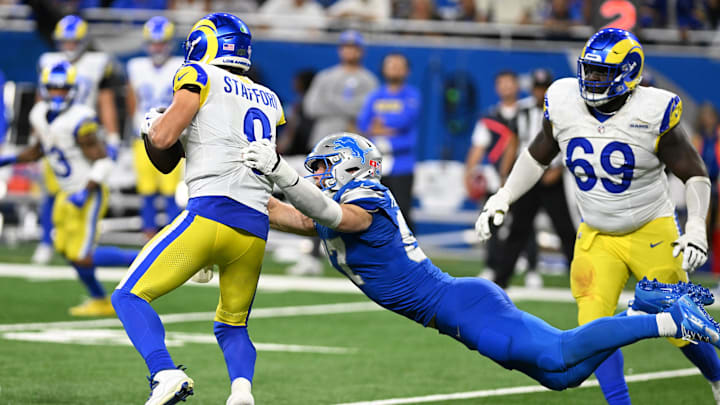 Sep 8, 2024; Detroit, Michigan, USA; Detroit Lions defensive end Aidan Hutchinson (97) sacks Los Angeles Rams quarterback Matthew Stafford (9) on the last play in regulation to send their game into overtime at Ford Field. Mandatory Credit: Lon Horwedel-Imagn Images
