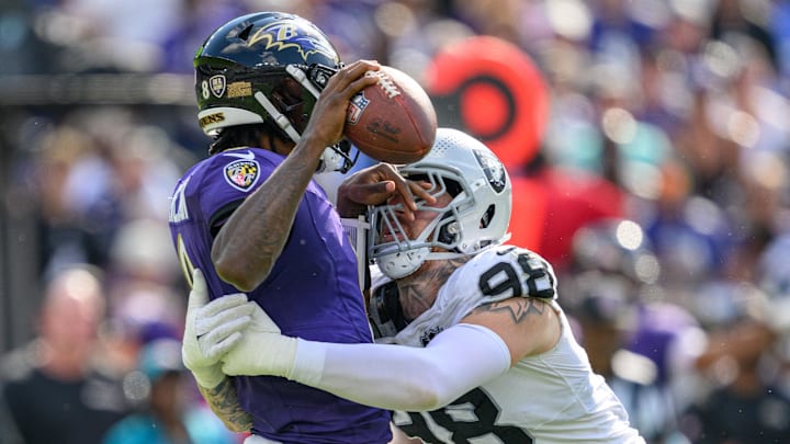 Las Vegas Raiders defensive end Maxx Crosby (98) sacks Baltimore Ravens quarterback Lamar Jackson (8) during the second half at M&T Bank Stadium. Las Vegas Raiders defensive end Maxx Crosby (98) sacks Baltimore Ravens quarterback Lamar Jackson (8) during the second half at M&T Bank Stadium.
