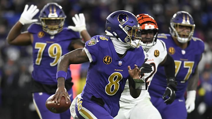 Nov 27, 2025; Baltimore, Maryland, USA; Baltimore Ravens quarterback Lamar Jackson (8) rushes thebasl against the Cincinnati Bengals during the second half at M&T Bank Stadium. Mandatory Credit: Tommy Gilligan-Imagn Images