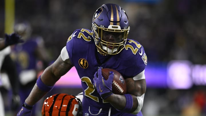 Nov 27, 2025; Baltimore, Maryland, USA; Baltimore Ravens running back Derrick Henry (22) rushes the ball against the Cincinnati Bengals during the first half at M&T Bank Stadium. Mandatory Credit: Tommy Gilligan-Imagn Images