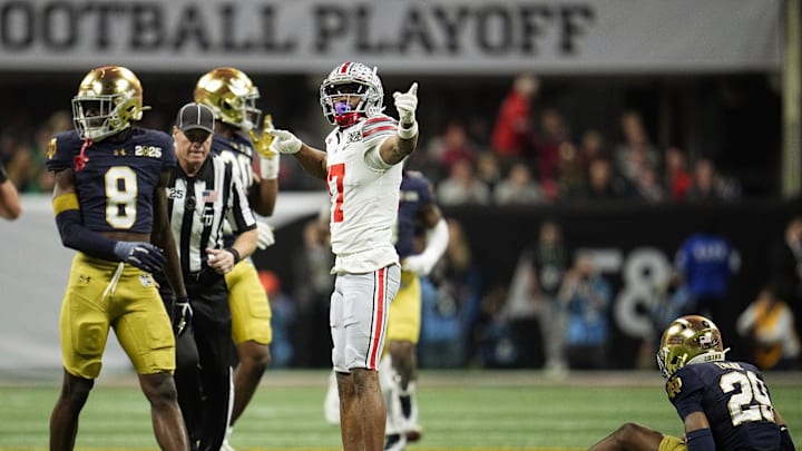 Ohio State Buckeyes wide receiver Carnell Tate (17) points for a first down after a catch against Notre Dame Fighting Irish in the second quarter during the College Football Playoff National Championship at Mercedes-Benz Stadium in Atlanta on January 20, 2025. Ohio State Buckeyes wide receiver Carnell Tate (17) points for a first down after a catch against Notre Dame Fighting Irish in the second quarter during the College Football Playoff National Championship at Mercedes-Benz Stadium in Atlanta on January 20, 2025.
