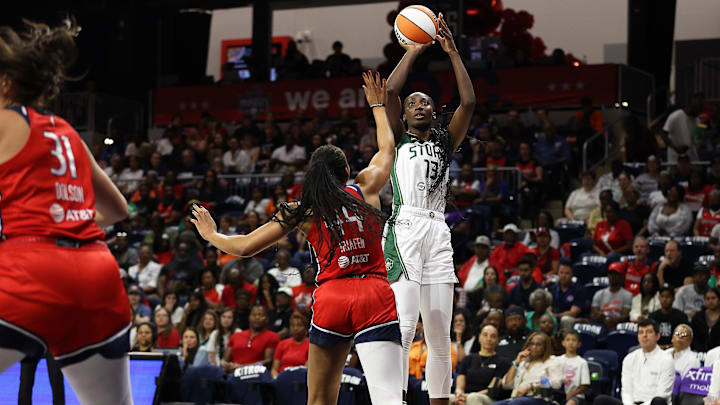 Aug 24, 2025; Washington, District of Columbia, USA; Seattle Storm forward Ezi Magbegor (13) takes a shot over Washington Mystics forward Kiki Iriafen (44) during the first half at CareFirst Arena. Mandatory Credit: Daniel Kucin Jr.-Imagn Images