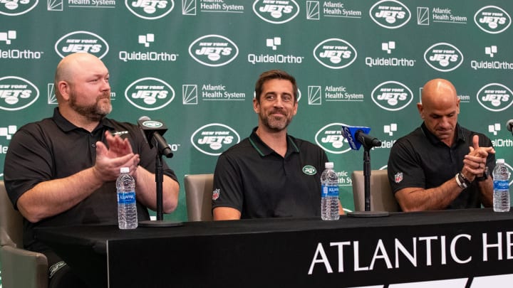 Apr 26, 2023; Florham Park, NJ, USA; New York Jets quarterback Aaron Rodgers (8) (center) is Apr 26, 2023; Florham Park, NJ, USA; New York Jets quarterback Aaron Rodgers (8) (center) is