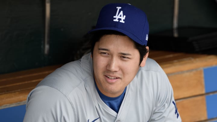Jul 14, 2024; Detroit, Michigan, USA;  Los Angeles Dodgers designated hitter Shohei Ohtani (17) talks with teammates in the dugout before their game against the Detroit Tigers at Comerica Park.